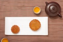 Traditional Chinese mooncakes and tea pot — Stock Photo