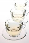 Glass tea cups with tea isolated on white background — Stock Photo