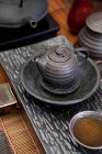 Traditional Chinese ceramic tea set with tea in cup — Stock Photo