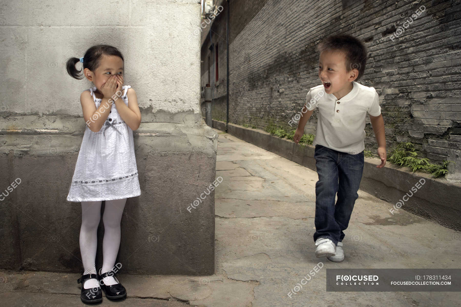Focused 178311434 Stock Photo Chinese Children Playing Hide Seek 