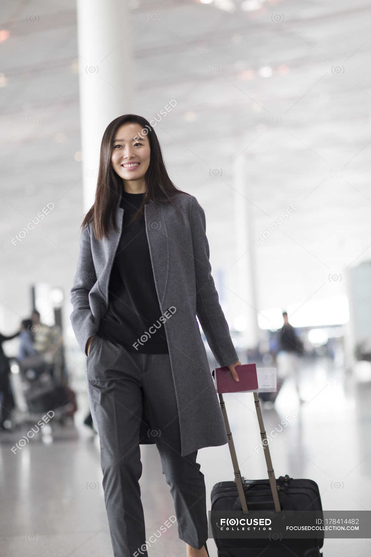 Premium Photo  Asian woman having troubles with luggage for