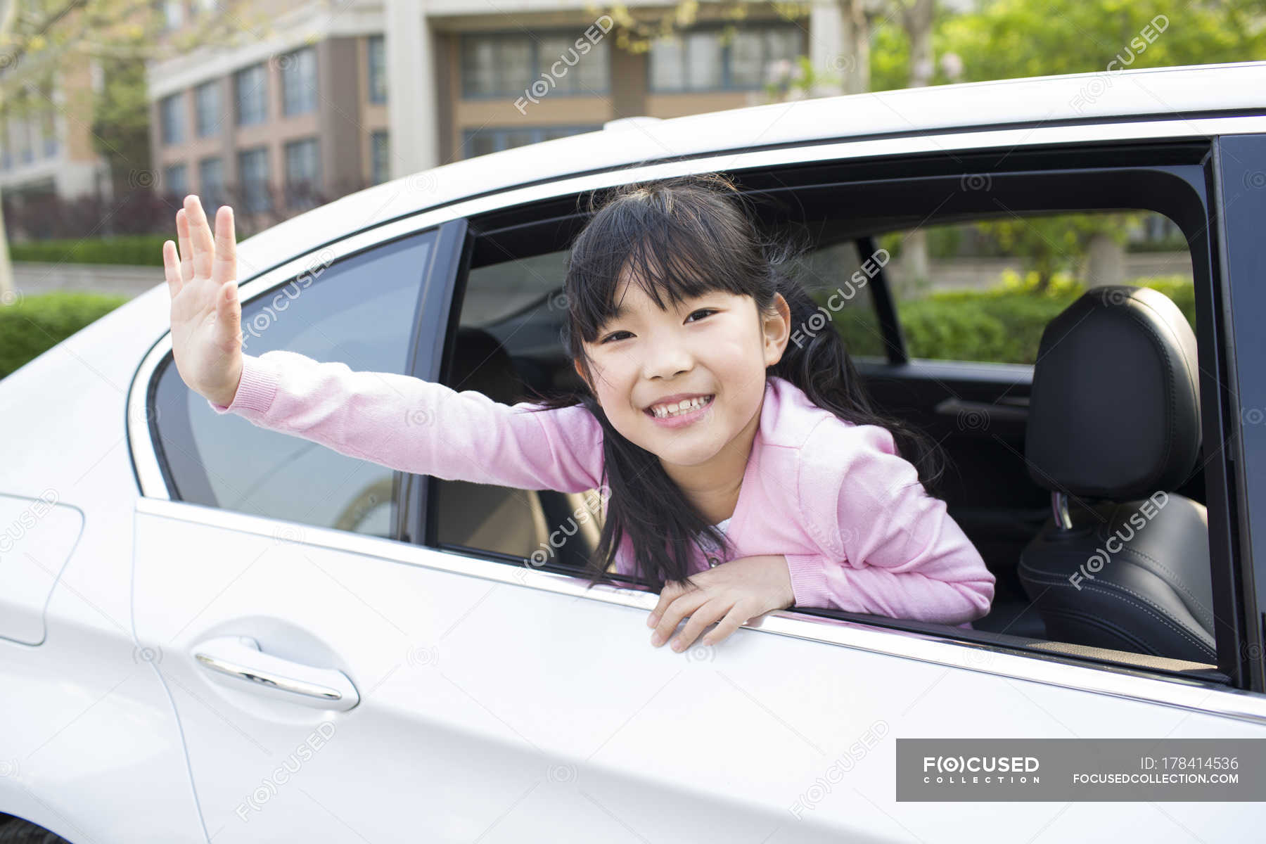 Leaning out of car