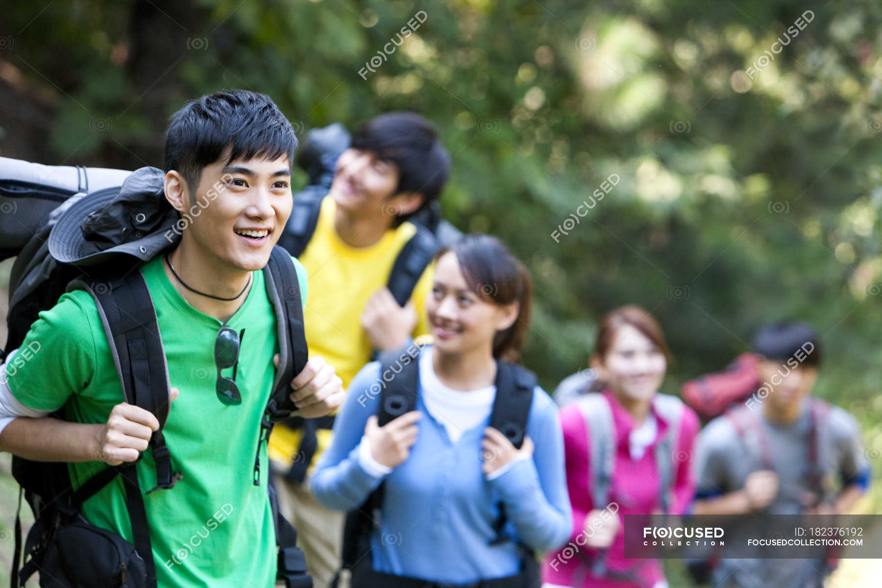 Group of Chinese backpackers hiking in forest — Men, Youth Culture ...