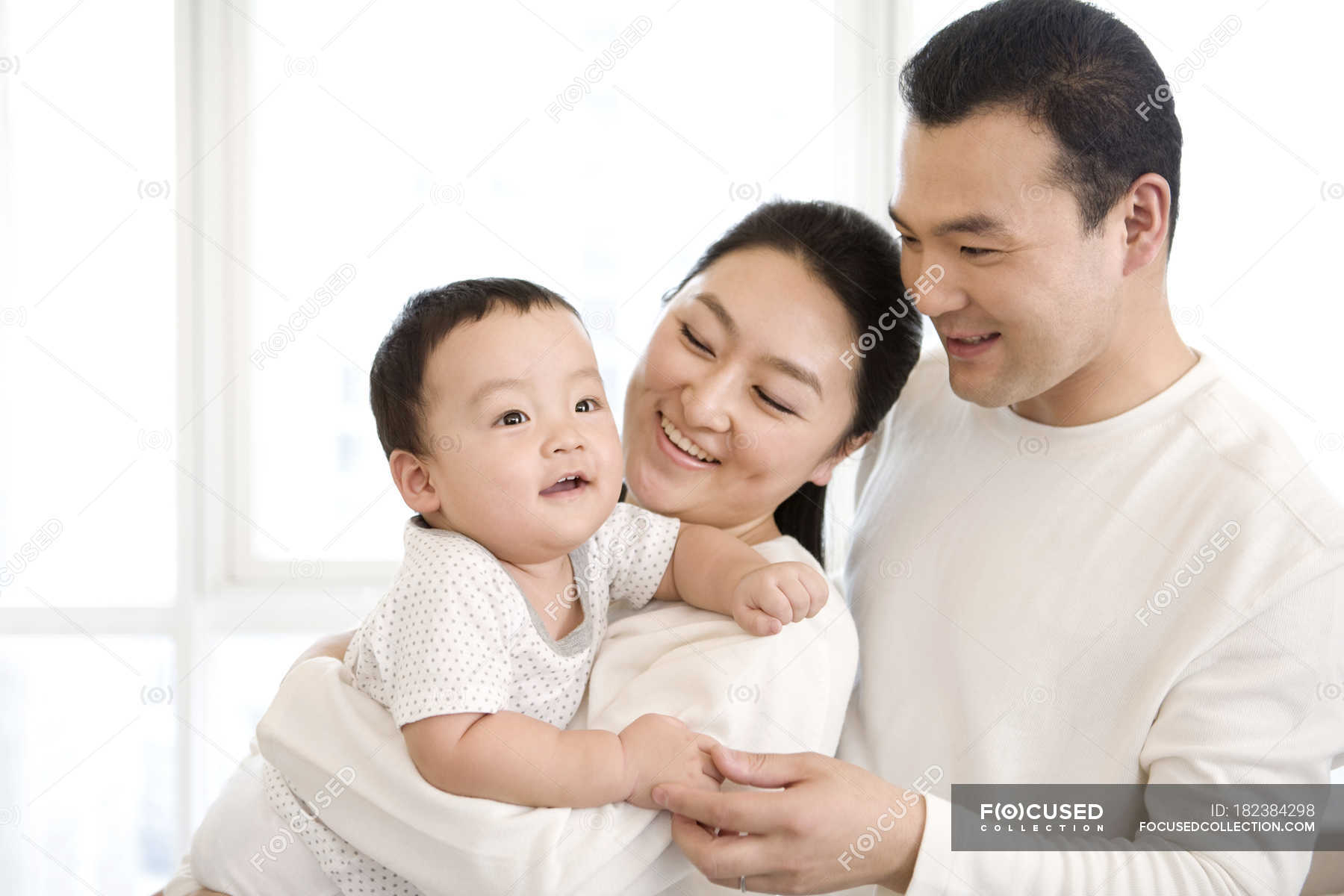 chinese-parents-holding-baby-son-standing-kid-stock-photo-182384298