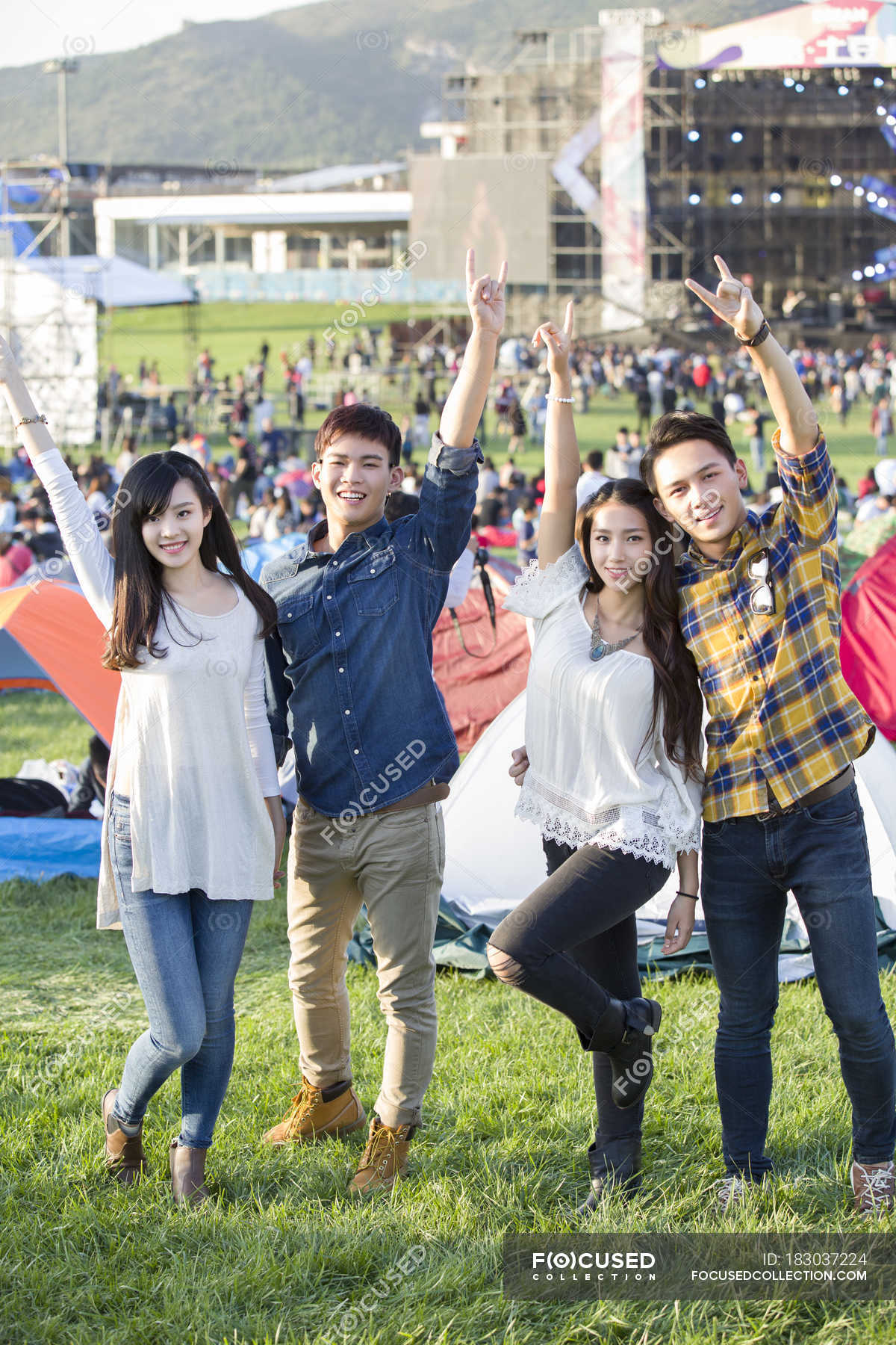 Chinese friends having fun at music festival camping — sunlight ...