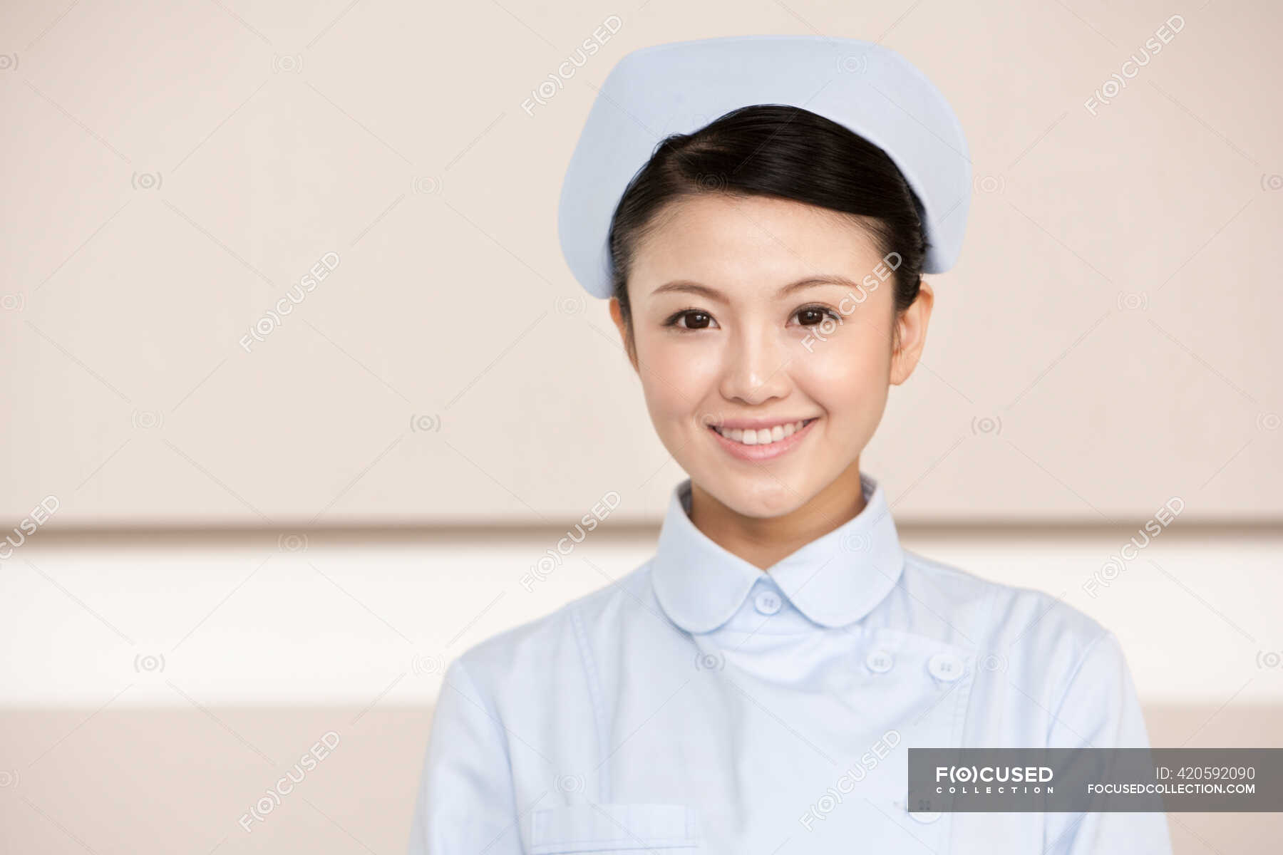 portrait-of-a-young-chinese-nurse-expertise-one-stock-photo