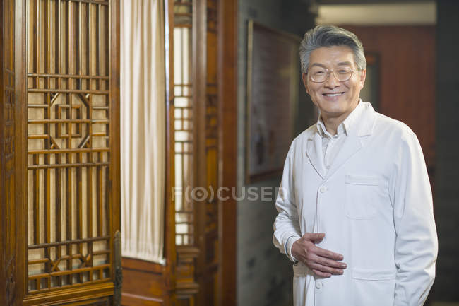 Portrait of mature chinese doctor — Stock Photo