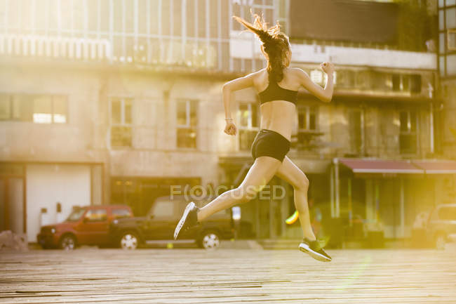 Chinese athlete running on street — Stock Photo