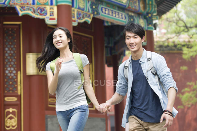 Chinese couple holding hands at Lama Temple — Stock Photo