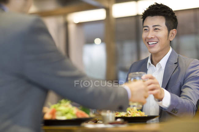 Chinese businessmen having dinner together — Stock Photo