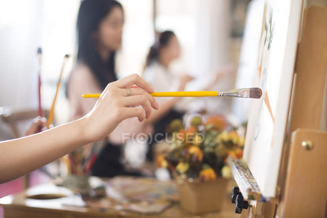 Women painting in art studio — Stock Photo