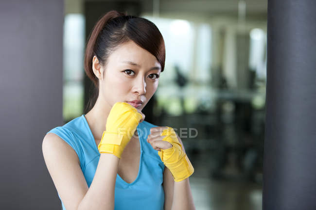 Portrait of Chinese woman in hand wraps — Stock Photo