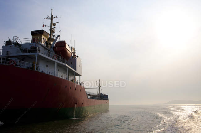 Cargo ship sailing through sea in China — Stock Photo