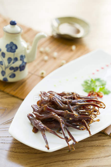 Chinese braised duck tongues dish — Stock Photo