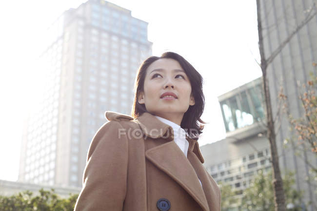 Portrait of Chinese woman in downtown — Stock Photo