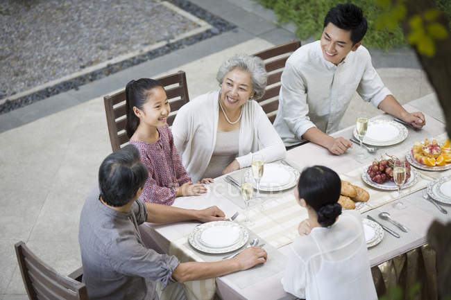 Chinese Multi Generation Family Sitting, Asian Dinner Table Setting