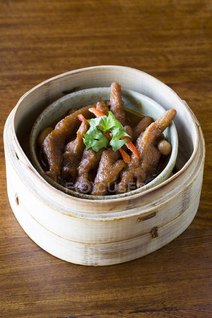 Chinese traditional chicken feet dish in steamer — Stock Photo