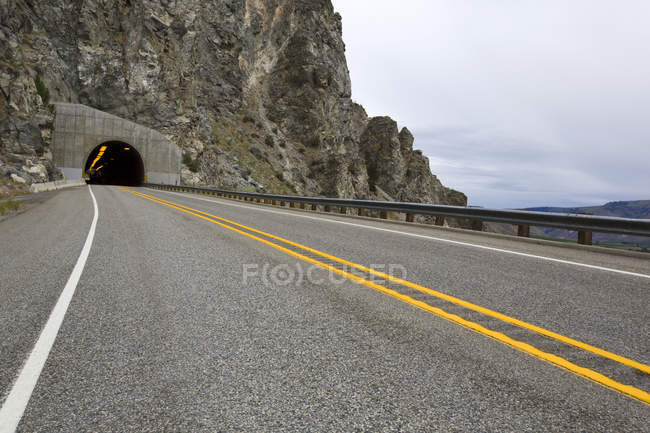 View of highway road through tunnel in rock — Stock Photo