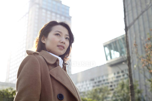 Portrait of Chinese woman in downtown — Stock Photo