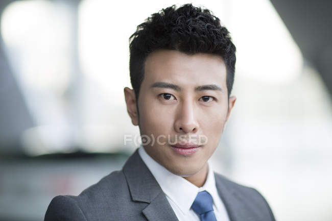 Portrait of chinese businessman looking in camera — Stock Photo