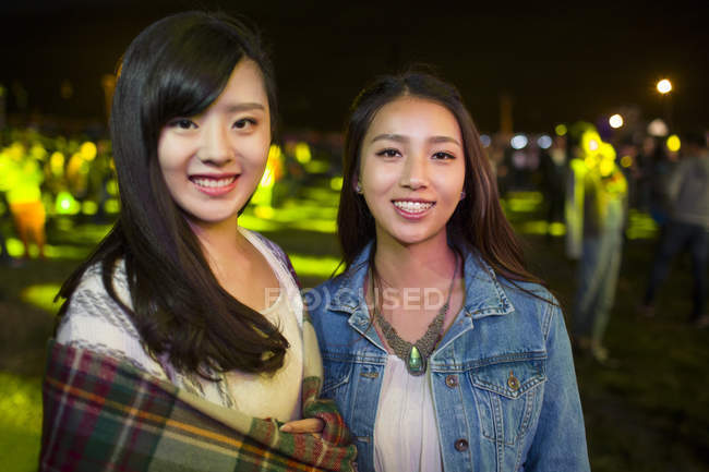 Chinese women posing at music festival — Stock Photo
