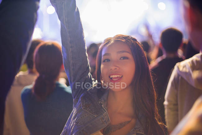 Chinese woman having fun at music festival — Stock Photo