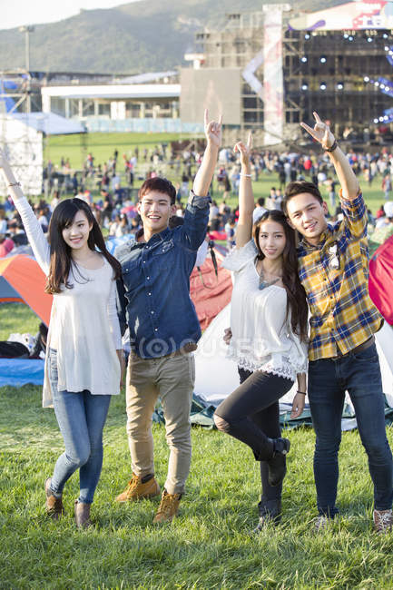 Chinese friends having fun at music festival camping — Stock Photo
