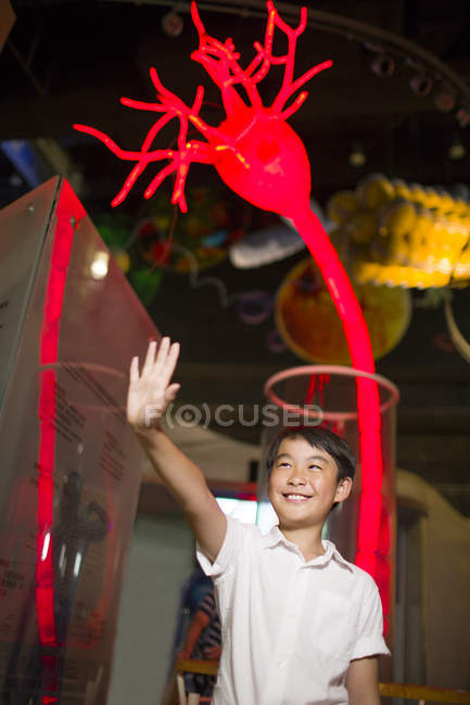 Chinese boy posing in science and technology museum — Stock Photo