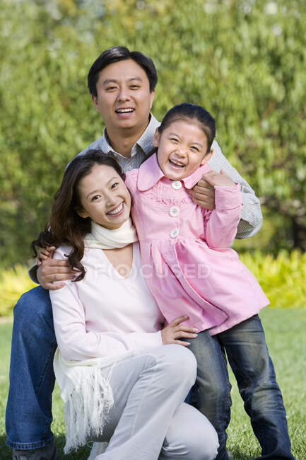 Portrait of a young Chinese family — Stock Photo