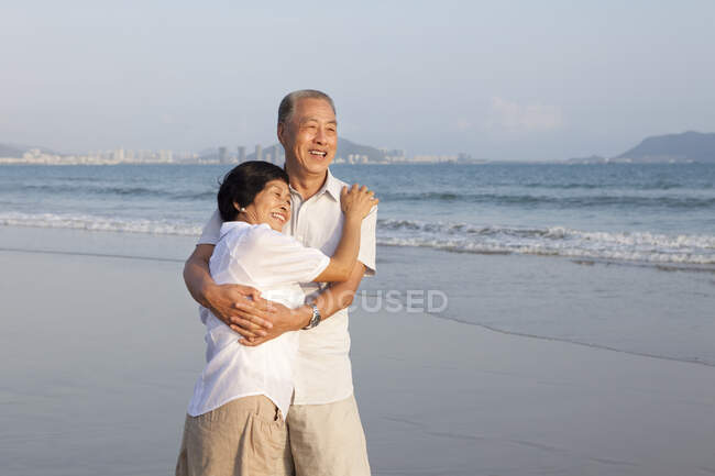 Portrait of a senior Chinese couple embracing — Stock Photo