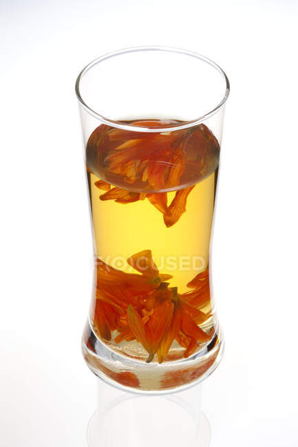 Glass of Chinese herbal tea, lily tea isolated on white background — Stock Photo