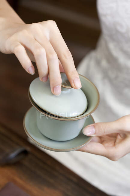 Cropped shot of woman performing tea ceremony — Stock Photo