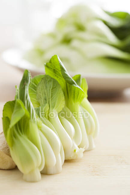 Bok choy on wooden board, close up shot — Stock Photo