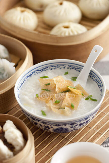 Traditional Chinese breakfast with various dishes served on table — Stock Photo