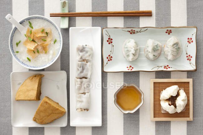 Traditional Chinese breakfast, various food served on table, top view — Stock Photo