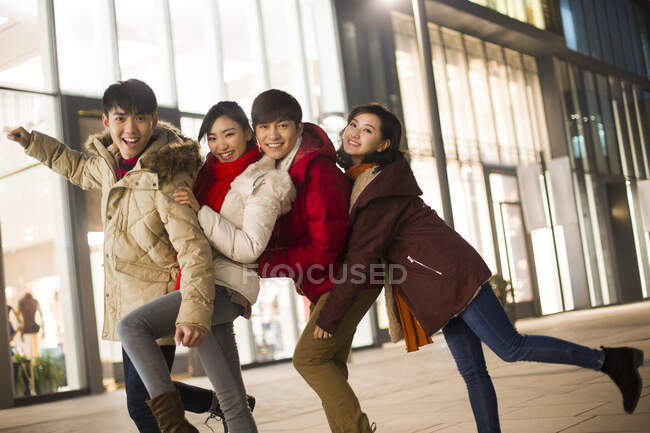 Happy young Chinese friends — Stock Photo