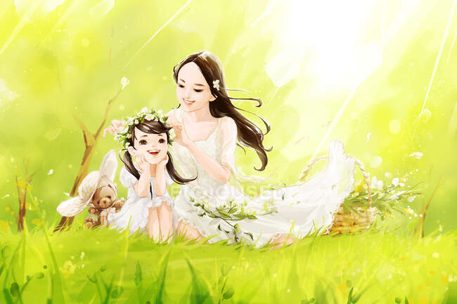 Happy Chinese mother and daughter sitting on green lawn — Stock Photo