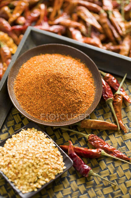 Red chili peppers, powder and seeds, close up shot — Stock Photo