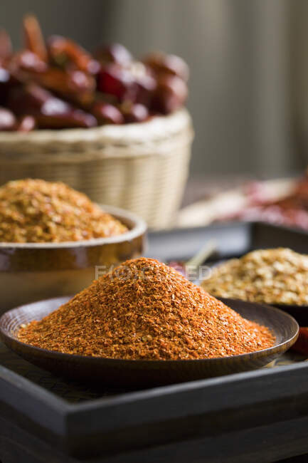 Chili pepper spices in bowls, close up shot — Stock Photo