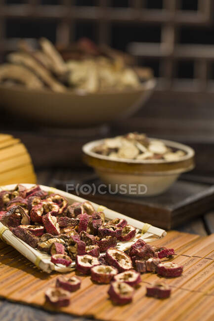 Dried and slices Hawthorne berries on wooden surface — Stock Photo