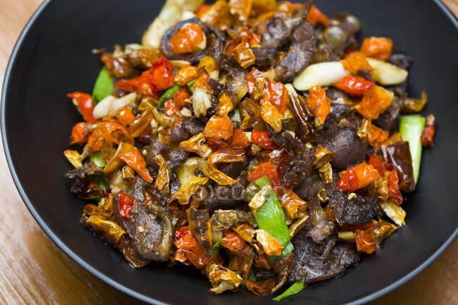 Chinese dish, spicy beef with chili peppers — Stock Photo