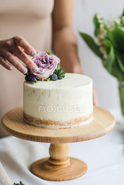 raw vegan cake with fruit and seeds, decorated with flowers Stock Photo -  Alamy