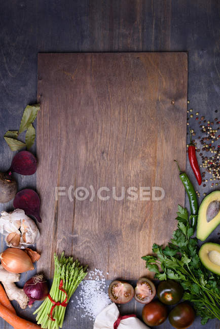 Healthy food background on wooden board. Vegetable menu. Top view, copy space. — Stock Photo