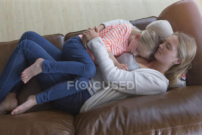 Mother and daughter napping together — Stock Photo