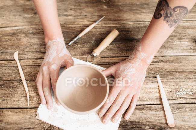 Pottery molding on wooden table top view — Stock Photo