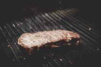 Roasted steak on grill — Stock Photo