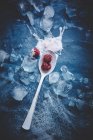 Spoon with raspberries and ice cream — Stock Photo