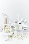 Female legs and healthy white ingredients — Stock Photo