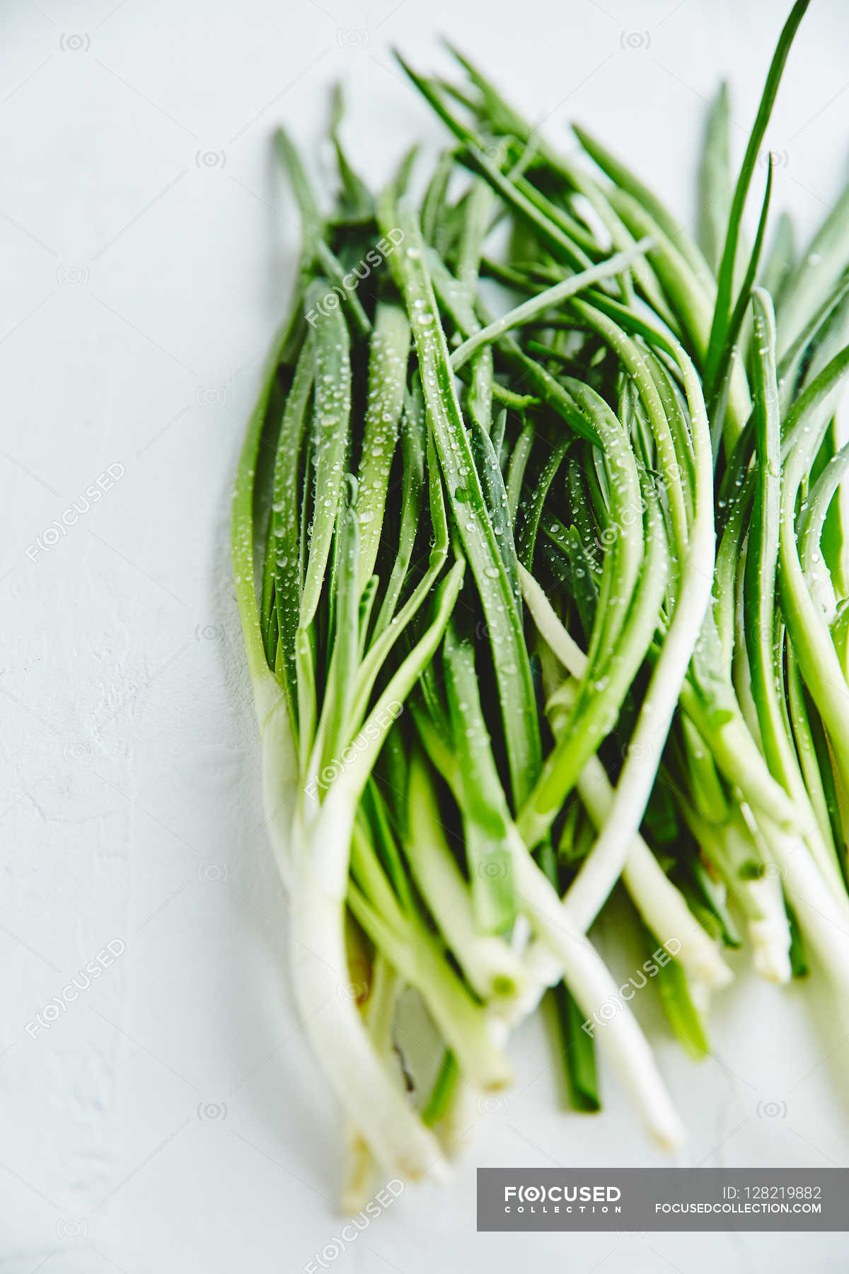 Fresh green onions — healthy food, vegan - Stock Photo | #128219882