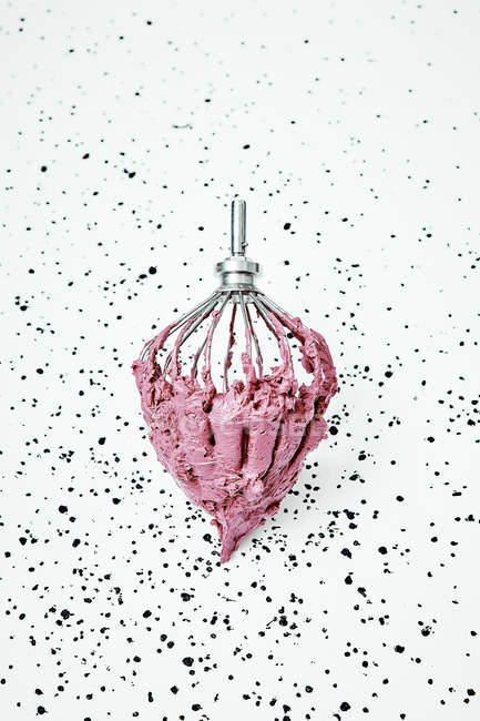 Pink cream on whisk — Stock Photo